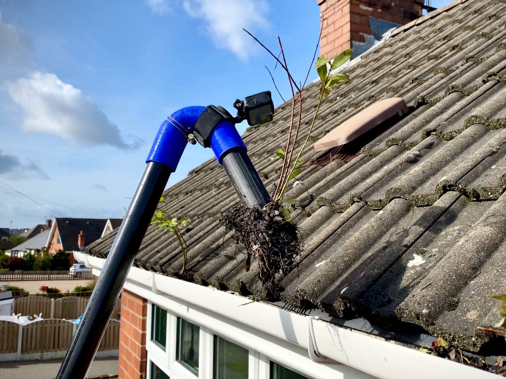 Gutter cleaning using high reach gutter vacume cleaning your gutters saftly from the ground , no climbing ladders ,  